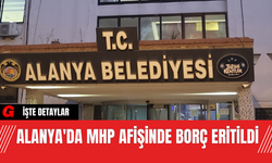 Alanya'da MHP Afişinde Borç Eritildi