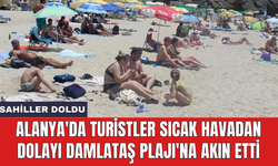 Alanya'da turistler sıcak havadan dolayı Damlataş Plajı'na akın etti
