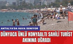 Antalya'da hava ısınıyor: Dünyaca ünlü Konyaaltı Sahili turist akınına uğradı