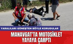 Manavgat'ta motosiklet yayaya çarptı: Yaralıları güneşten böyle korudular